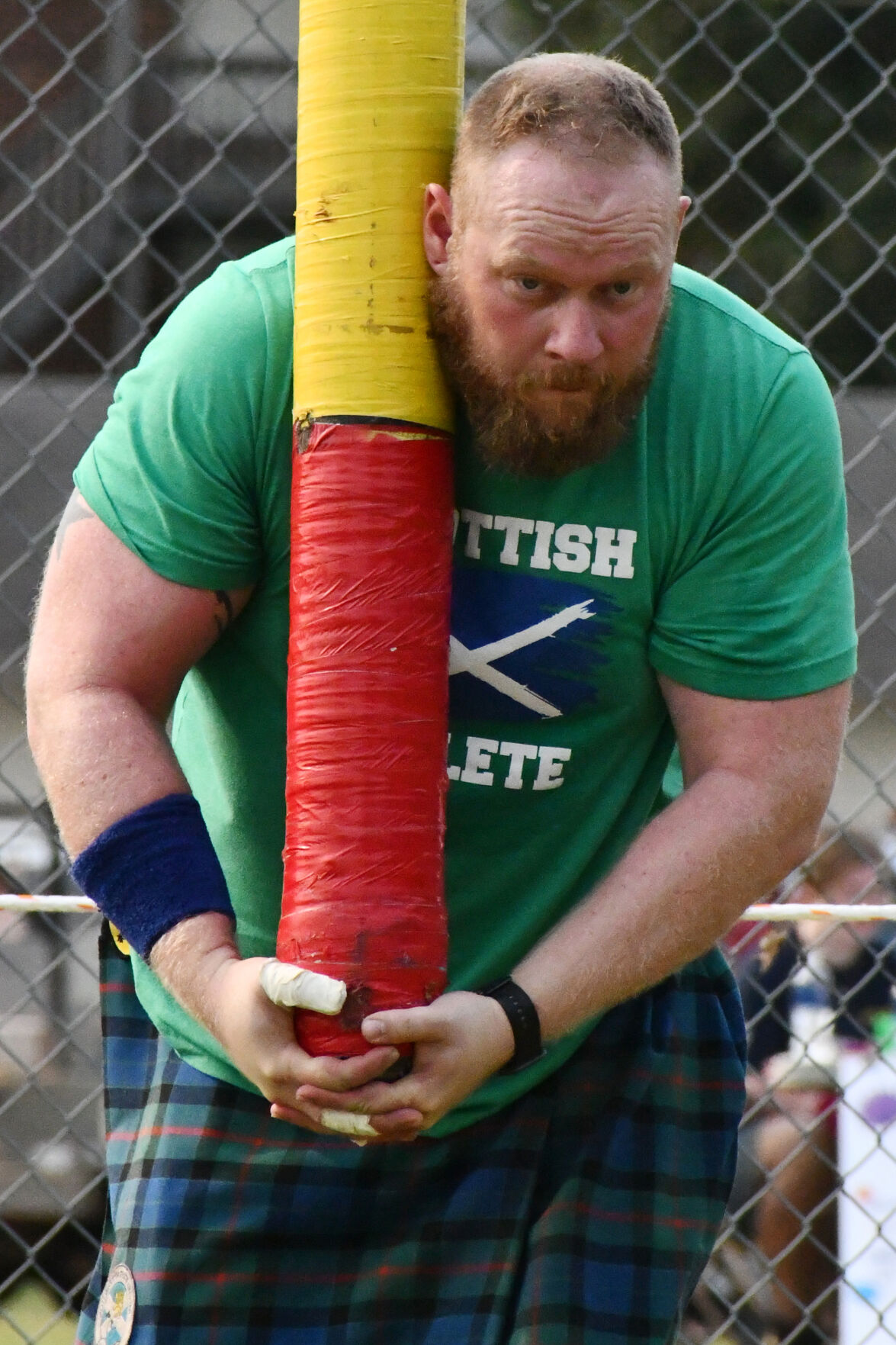 Alex Griffith tosses the caber